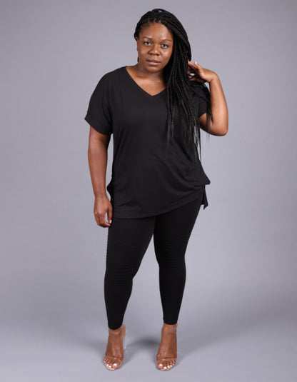 a v neck short sleeve black blouse with black ankle length leggings